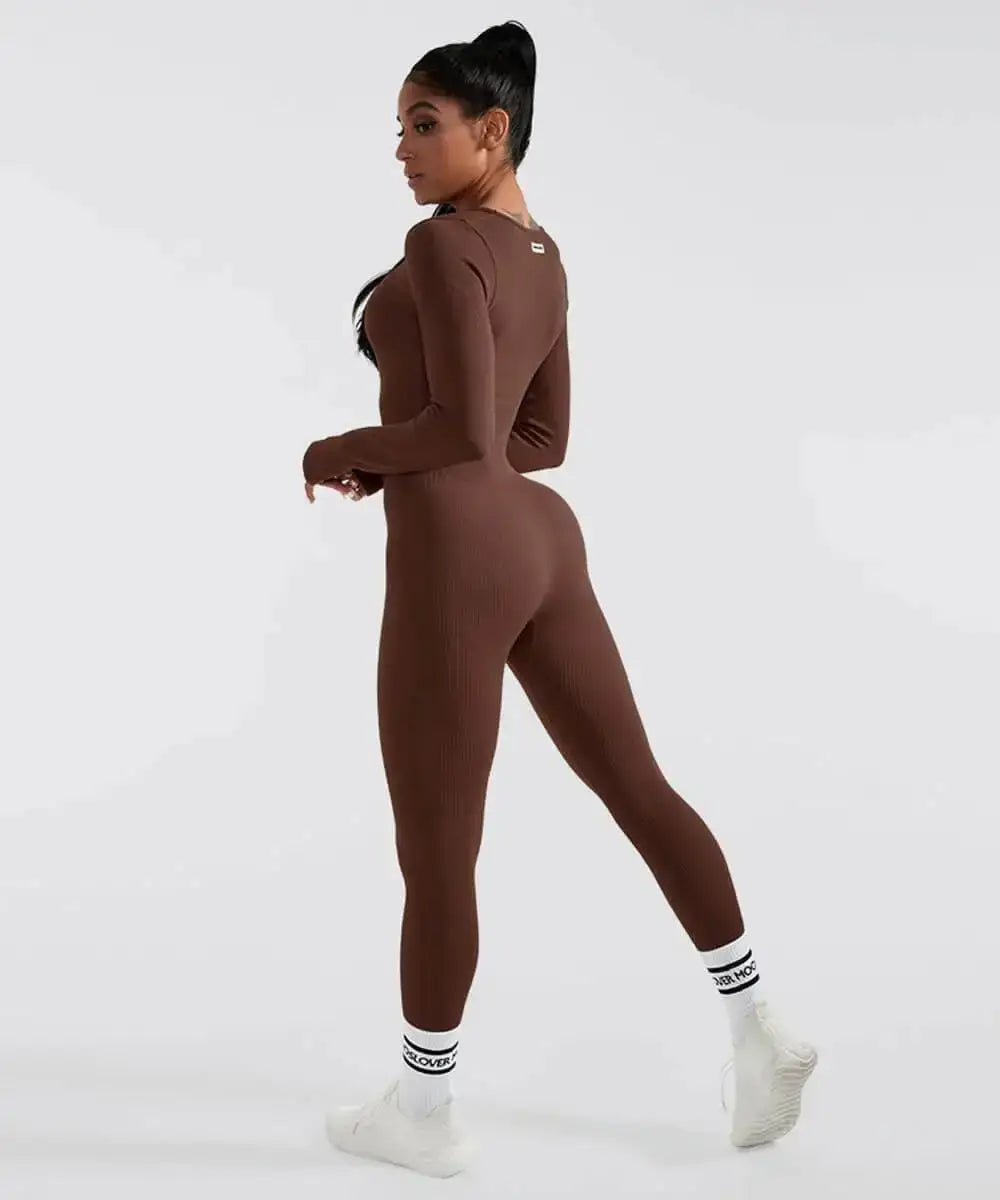 Woman wearing brown long sleeve shapewear bodysuit, side view