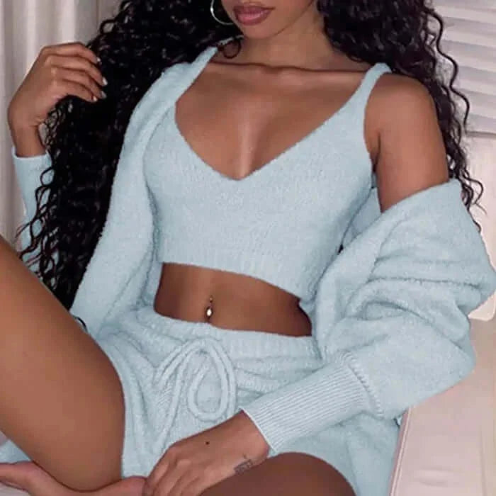 woman wearing women's 3 piece lounge pajama set with cardigan, top, and pants in light blue color, showcasing comfortable sleepwear outfit