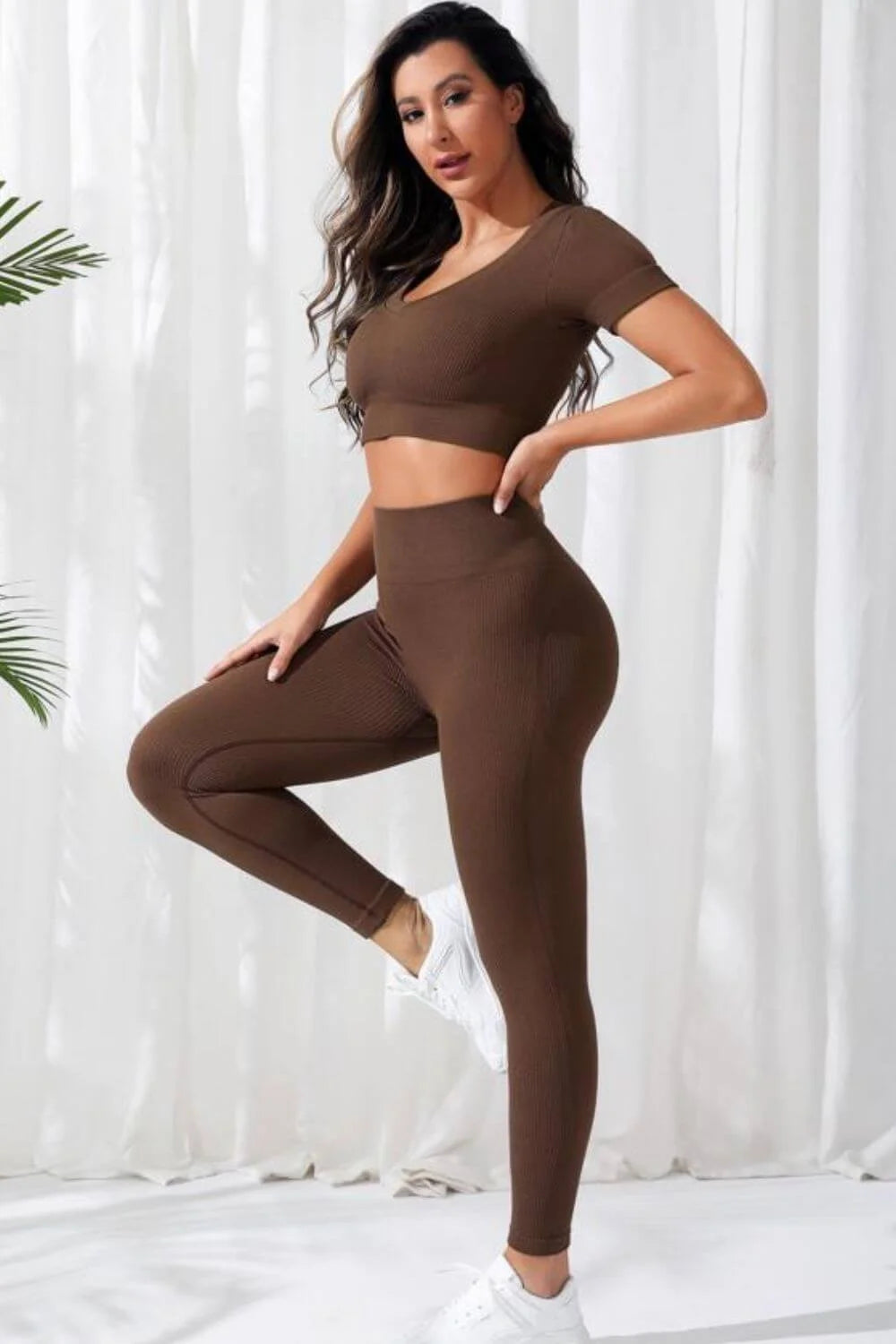 Women’s Seamless V-Neck Crop Top & High-Waist Leggings Set in solid brown, short sleeves, sporty style, ideal for yoga.